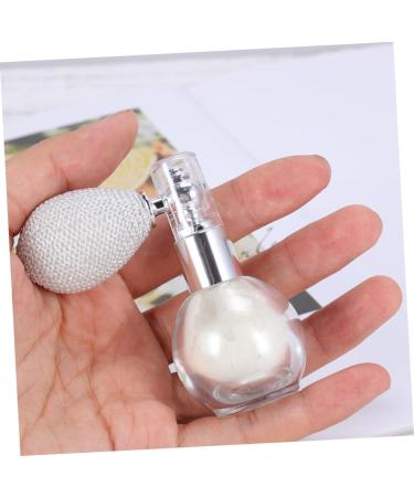 Shimmer powder puff spray bottle held in hand