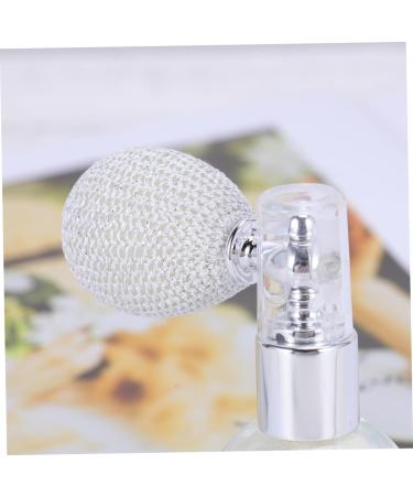 Close up of shimmer powder squeeze bulb applicator